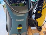 an electric pressurer sitting on top of a pallet in a warehouse