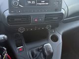 a dashboard of a car with a steering control in it