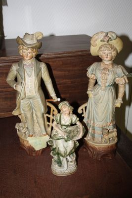 two figurines that are sitting on a table