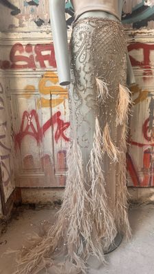 a mannequin in a room with graffiti on the walls