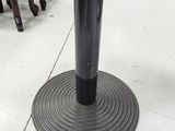 an image of a black metal table with a black base