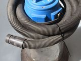 a blue hose that is connected to a metal object