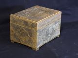 an old wooden box sitting on top of a black table