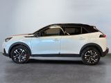 a white toyota c - hr suv parked in a showroom