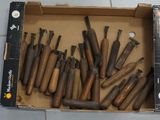 a box full of different types of tools on the floor