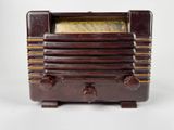 an old radio that is sitting on top of a table