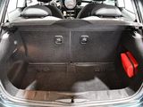 a trunk of a car with a red bag in it