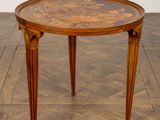 an image of a table with a wooden top on a parquet floor
