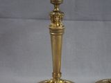 pair of antique brass candlesticks on a white background