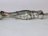 a silver spoon that is sitting on a table