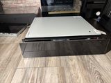 a white computer sitting on top of a wooden floor