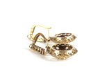 pair of gold tone earrings with black stones on a white background