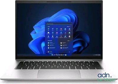 an open laptop computer sitting on top of a white surface