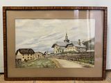 framed painting of a rural scene with a church and a road
