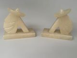 pair of art deco bookends in the shape of a woman with a parasol