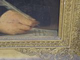 a painting of a man writing with a quill in his hand