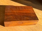 an old wooden box sitting on top of a wooden floor