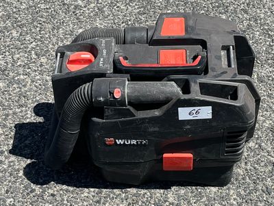 a black and red vacuum sitting on the ground