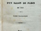 an old book that is open on a table
