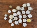 many different types of clocks on a wooden table