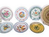 a lot of plates that are sitting on a table