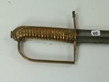 a very old sword that is laying on a table