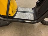 a scooter that is parked in a parking lot