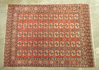 an orange and blue rug with a pattern on it