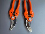 two orange pliers that are on display in a store