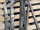 some old tools on a pallet next to a fan