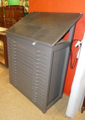 a gray cabinet with drawers in the corner of a room