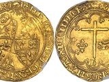 a gold coin with a cross on the front and a cross on the back