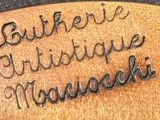 a close up of a guitar pick with a name engraved on it