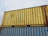 a yellow and blue container sitting on top of a building