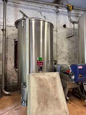a large metal tank in the middle of a room