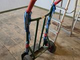 a small hand truck with a ladder on the floor