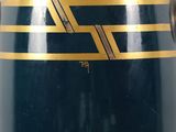 a blue vase with gold stripes on it