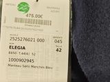 a label on the back of a jacket with a barcode on it