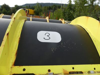 a black and yellow trash can with a number 3 on it