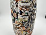 a vase that has a lot of different designs on it