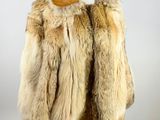 an image of a fur coat on a mannequin stand