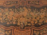 a wooden table with a floral design on it