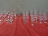 many empty wine glasses sitting on a red table