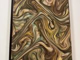 a close up of a notebook with a swirl design on it