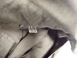 a close up of a shirt with a button on it