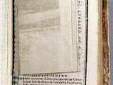 an open book with a page in it sitting on top of a table