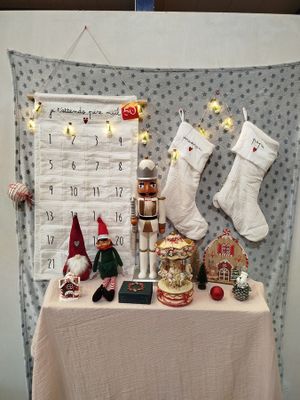a table with christmas decorations and a calendar on it