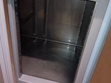 an image of a kitchen with a stainless steel refrigerator