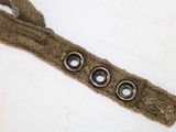 an image of a brown belt with buttons on it