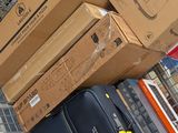 boxes stacked on top of each other on a cart in a store